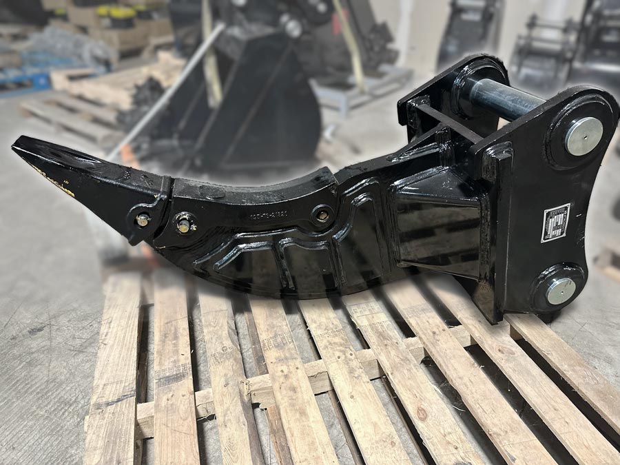 Ripper designed for a Komatsu excavator, sitting on a pallet.