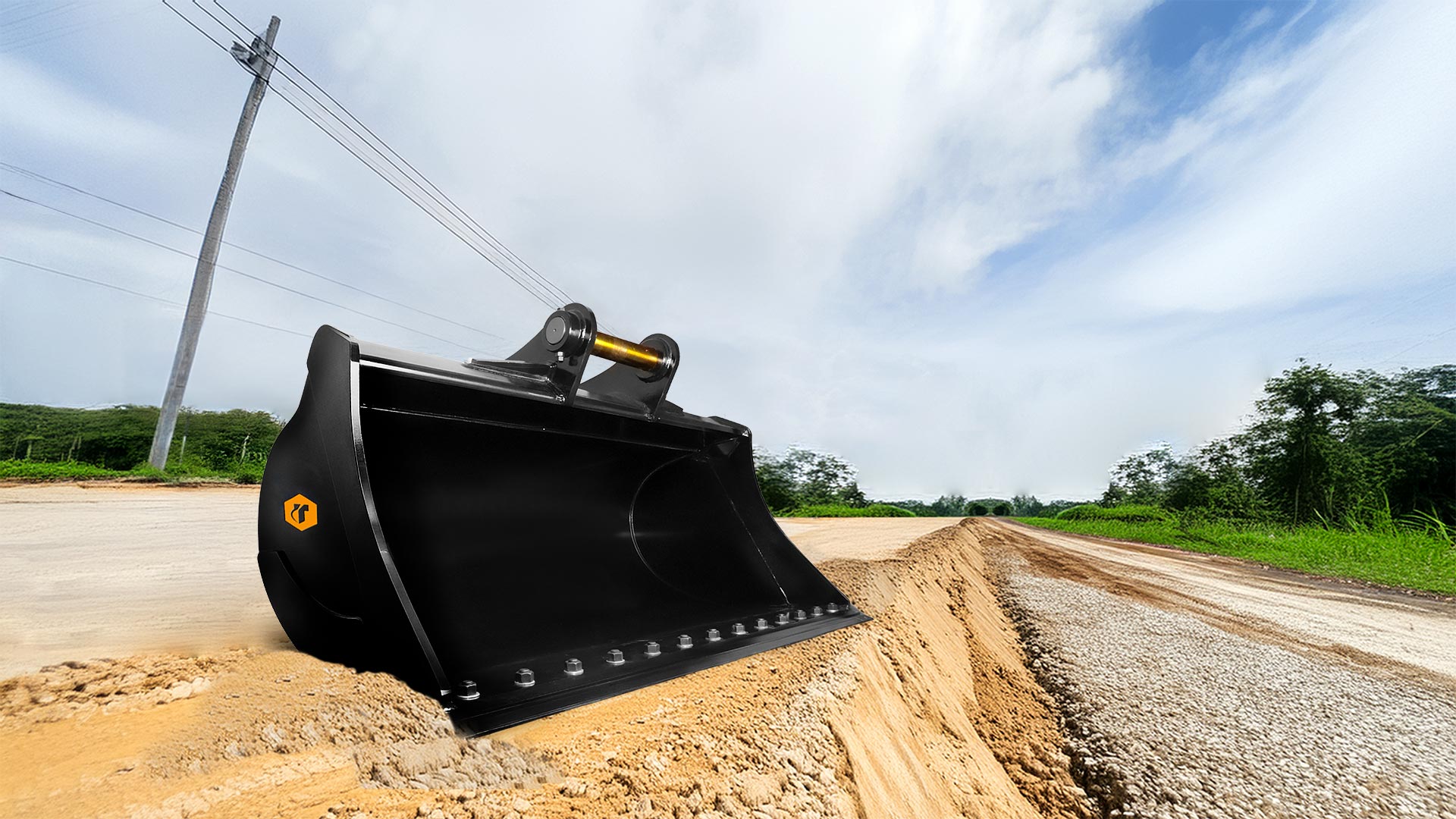 Excavator ditching bucket sitting on the ground.
